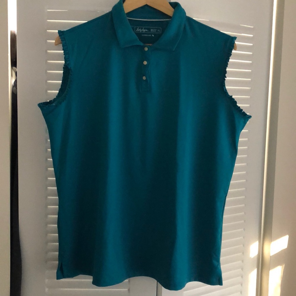 Turquoise golf top with ruffle sleeves
